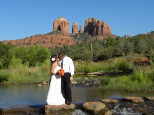 bride and groom take a moment in the middle of red rock crossing